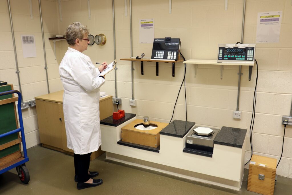 A Trading Standards Officer tests weights in the calibration lab